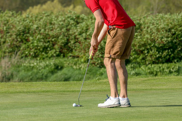 A golf player on a green