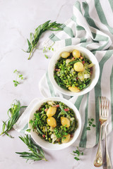 Green stewed vegetables (green peas, lettuce) with onions and lardons, two servings