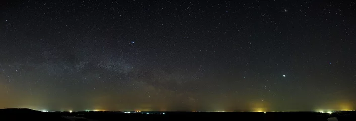 Foto auf Acrylglas Night sky with the stars of the Milky Way galaxy. Panoramic view of the starry space. © olgapkurguzova