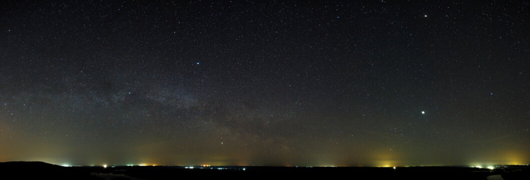 Night sky with the stars of the Milky Way galaxy. Panoramic view of the starry space.