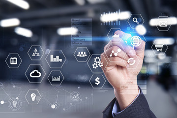 Business and technology concept. Graphs and icons on virtual screen background.