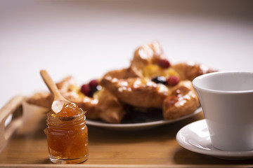 Breakfast in bed. Tray with coffee and croissants