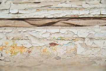 Fragments of the old paint on the wall. Back background.