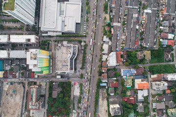 Top view aerial view of modern condominium building with house and flat