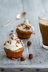 cupcakes with white butter cream and chocolate chips for sweet time