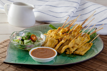 Grilled pork served with peanut sauce or sweet and sour sauce, Thai food