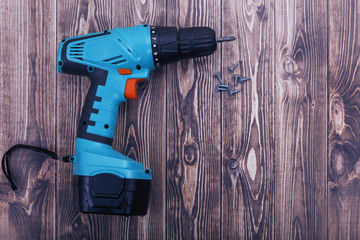 modern accumulator screwdriver and screws closeup.