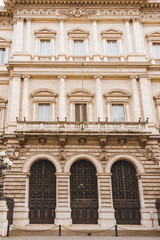 Fototapeta na wymiar bottom view of old building with balcony in Rome, Italy