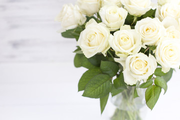 Obraz na płótnie Canvas Bouquet of white roses in a vase. Bouquet of chic white roses