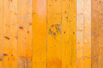 The boards are painted in yellow and a little with peeling paint