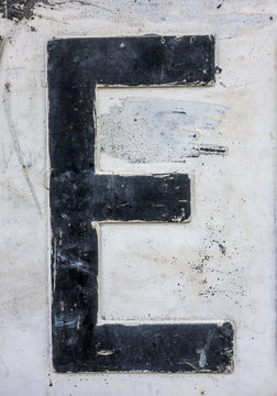 Written Wording in Distressed State Typography Found Letter F