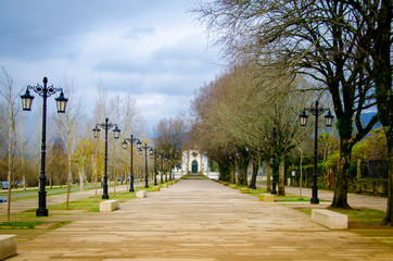 Old avenue with church in the end