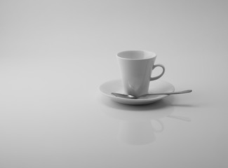 empty white cup reflecting in white surface on white background