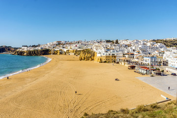 Fototapeta na wymiar Amazingly wide, almost empty Fishermen Beach in Albufeira, Algarve, Portugal