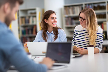 University students working in the library at campus
