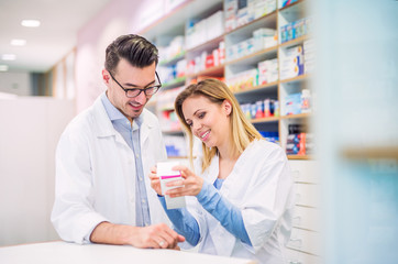 Two pharmacists working in a drugstore.