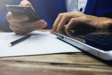 Close up of a man holding mobile phone
