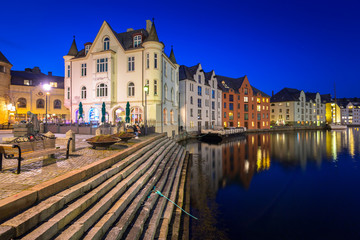 Naklejka na ściany i meble Architecture of Alesund town at night in Norway