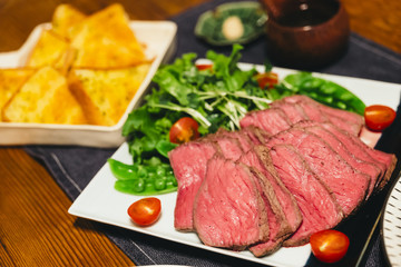 Roast beef and toast on the table