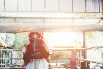 Woman in the Ring of thai boxing outdoor