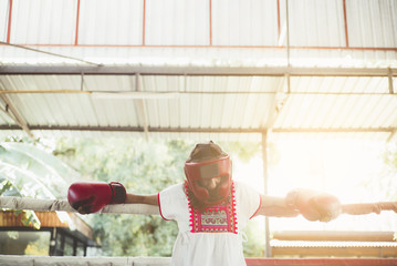 Woman in the Ring of thai boxing outdoor