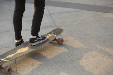 Closeup of woman skateboarding at a skateboard park