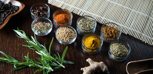 Fresh basil and dry set of spices. place for text