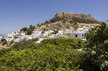 Panorama of a sunny day of Lindos with the castle above on the Greek Island of Rhodes.