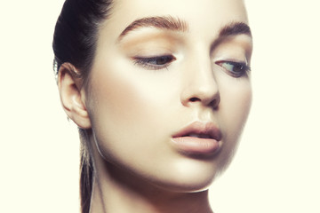 Fototapeta premium Close-up beautiful face of model girl with perfect nude make-up and natural lips, clean skin, brows. 