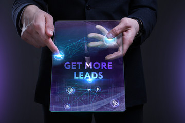 Business, Technology, Internet and network concept. Young businessman working on a virtual screen of the future and sees the inscription: Get more leads