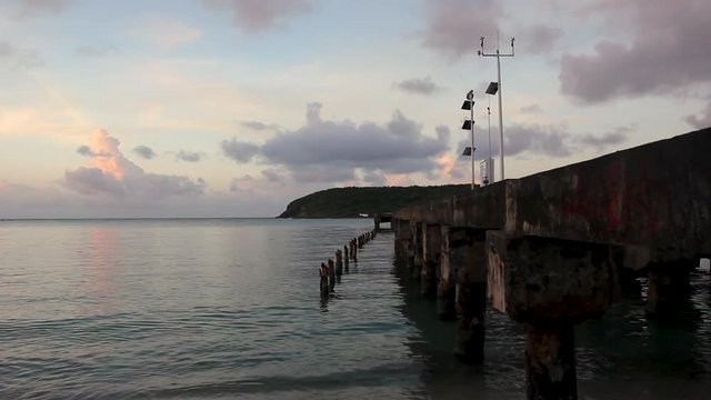 Cloud time lapse over sugar cane pier, Vieques Island, Puerto Rico