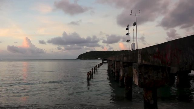 Clouds and waves at historic sugar cane pier, Vieques Island, Puerto Rico