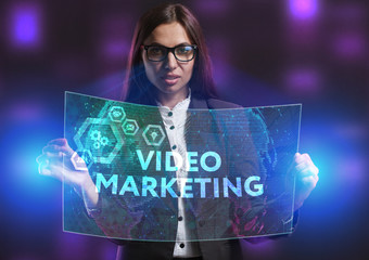 The concept of business, technology, the Internet and the network. A young entrepreneur working on a virtual screen of the future and sees the inscription: Video marketing