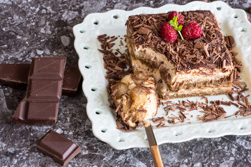 Tiramisu Cake with Grated Chocolate, Raspberry and Mint. Perfect Dessert.