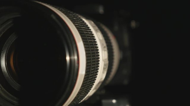 DSLR digital camera isolated on black background