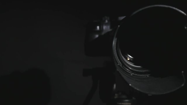 Photo shoot DSLR camera. 4K UHD video.Professional DSLR camera low key footage