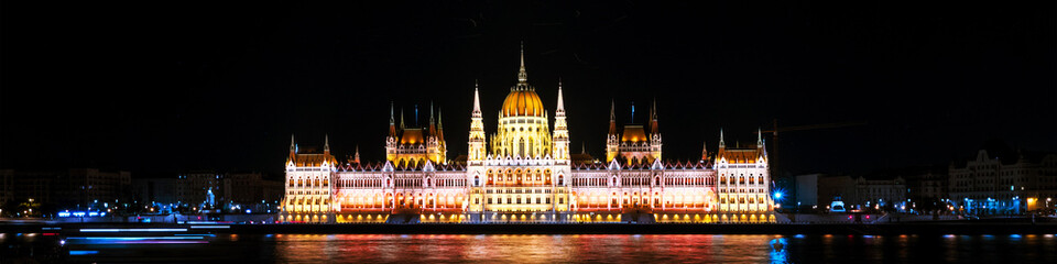 Fototapeta na wymiar Night view of illuminated Parliament building in Budapest, Hungary