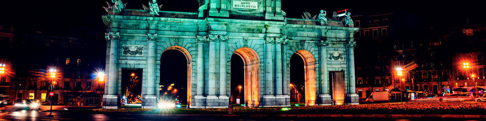 Night view of The Puerta de Alcala at night - a monument in the Independence Square in Madrid, Spain