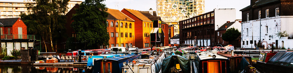 Fototapeta na wymiar Boats moored in the evening at famous Birmingham canal in UK