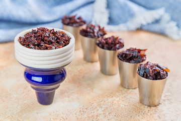 shisha with Apple flavor in glossy deep blue bowl, cooked for Smoking