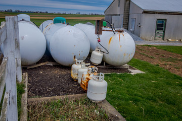 View of propane tanks outside of amish family home used as alternative power source to electricity...