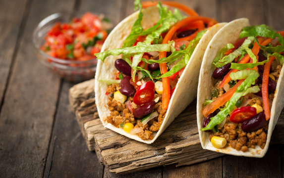 Mexican tacos with beef, vegetables and spices 