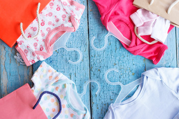 Different clothes for a newborn and paper packages