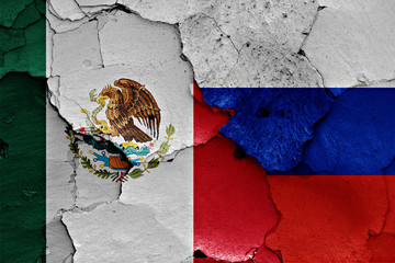 flags of Mexico and Russia painted on cracked wall