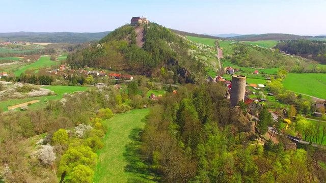 Drone flight around Zebrak Castle. A ruin of a Gothic castle originated in the 13th century. Since 1336 a royal castle, enlarged by Kings Charles IV. Czech famous monument from above. 