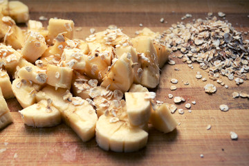 banana and oatmeal on a wooden board