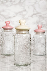 Empty Glass Jars on White Marble Background