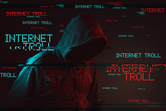 Internet troll concept with faceless hooded male person