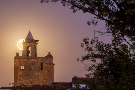 Bell tower of church with super moon