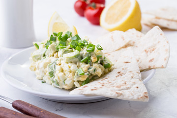 Egg salad with avocado, Mexican style breakfast